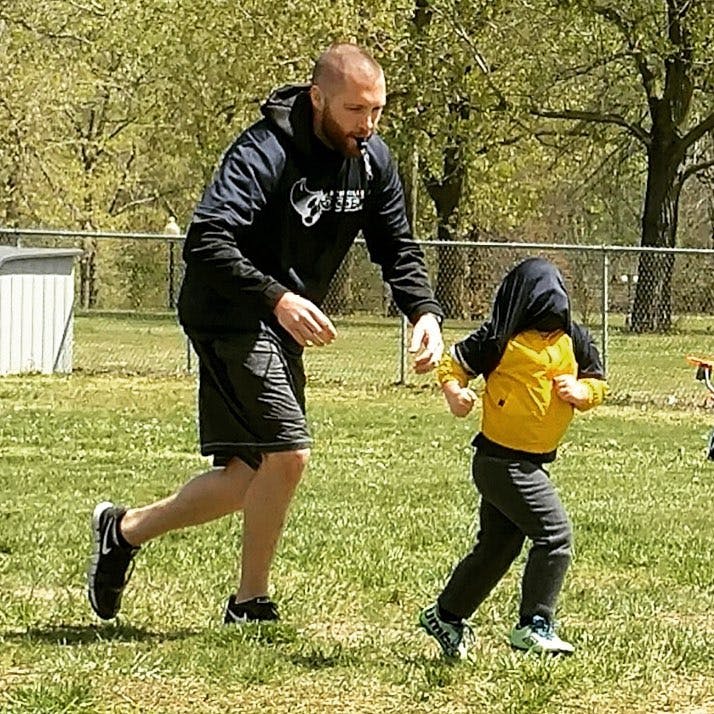 Me doing my best to wrangle kids as a pre-k soccer coach